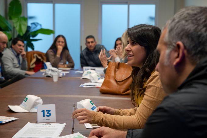 Professor speaking at a table with others at IEEE MBA University of Montevideo Uruguay